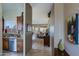Hallway with view of open floor plan, including kitchen with stainless steel appliances and living area at 10250 E Morning Star Dr, Scottsdale, AZ 85255