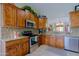 Cozy kitchen boasting stainless steel appliances, granite countertops, and wooden cabinetry at 10250 E Morning Star Dr, Scottsdale, AZ 85255