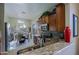 Bright kitchen with granite countertops, stainless steel appliances, and eat-in dining area at 10250 E Morning Star Dr, Scottsdale, AZ 85255