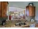 Gourmet kitchen featuring granite countertops, stainless steel appliances, and an open serving area at 10250 E Morning Star Dr, Scottsdale, AZ 85255