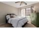 Cozy bedroom featuring a comfortable bed, large window for natural light, and tasteful decor at 11175 N 109Th Pl, Scottsdale, AZ 85259