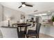 Open floor plan with a dining area features a table with seating adjacent to the modern kitchen at 11175 N 109Th Pl, Scottsdale, AZ 85259