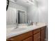 Bathroom featuring double sinks, wood cabinets and neutral paint at 11851 W Alvarado Rd, Avondale, AZ 85392