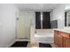 Bright bathroom with a shower and soaking tub, perfect for relaxation and comfort at 11851 W Alvarado Rd, Avondale, AZ 85392