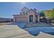 Charming two-story home with a well-maintained lawn and a two-car garage at 11851 W Alvarado Rd, Avondale, AZ 85392