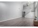Spacious living area with a staircase, high ceilings, and neutral color palette at 11851 W Alvarado Rd, Avondale, AZ 85392