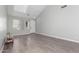 Bright living room with neutral walls, high ceilings, and wood-look tile floors at 11851 W Alvarado Rd, Avondale, AZ 85392