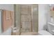Bathroom with a glass enclosed shower, decorative tiles, and neutral wall color at 12050 N Panorama Dr # 107, Fountain Hills, AZ 85268
