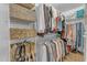 Walk-in closet with ample shelving and hanging space for organized storage of clothing, shoes, and accessories at 12050 N Panorama Dr # 107, Fountain Hills, AZ 85268