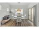 Cozy dining area with a round table, four chairs, and a cushioned bench near the windows at 12050 N Panorama Dr # 107, Fountain Hills, AZ 85268