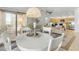Dining room featuring a round white table, four chairs, and sliding glass doors leading to the patio at 12050 N Panorama Dr # 107, Fountain Hills, AZ 85268
