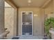 Close-up of unit 107 entrance showcasing a secured front door with a decorative screen and textured walls at 12050 N Panorama Dr # 107, Fountain Hills, AZ 85268