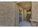 Close-up of unit 107 entrance showcasing a secured front door with a decorative screen and textured walls at 12050 N Panorama Dr # 107, Fountain Hills, AZ 85268