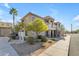 Inviting two-story condo building with stucco exterior, mature landscaping, and walkways at 12050 N Panorama Dr # 107, Fountain Hills, AZ 85268