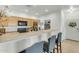 Open-concept kitchen features a breakfast bar with seating, stainless steel appliances, and ample storage at 12050 N Panorama Dr # 107, Fountain Hills, AZ 85268