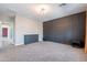 Large bedroom with a statement wall, a dresser, and access to other rooms at 1255 N Arizona Ave # 1246, Chandler, AZ 85225