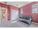 Bedroom features a gray sofa, plush carpeting and windows to let in natural light at 1255 N Arizona Ave # 1246, Chandler, AZ 85225