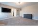 Bedroom featuring an entertainment center, dresser and doorway to a bathroom at 1255 N Arizona Ave # 1246, Chandler, AZ 85225
