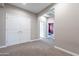 Spacious bedroom with carpeting and open hallway to the rest of the home at 1255 N Arizona Ave # 1246, Chandler, AZ 85225