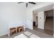 Bedroom featuring a white desk, comfortable stools, and access to the staircase at 1255 N Arizona Ave # 1246, Chandler, AZ 85225