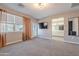 Bright bedroom features a patio door and an open door leading to the bathroom at 1255 N Arizona Ave # 1246, Chandler, AZ 85225