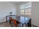 Cozy dining room featuring a dark wood table, modern chairs, and natural light at 1255 N Arizona Ave # 1246, Chandler, AZ 85225