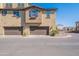 Modern two-story townhome with a two car garage, manicured landscaping, and neutral paint at 1255 N Arizona Ave # 1246, Chandler, AZ 85225