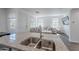 Kitchen with granite countertops, stainless steel sink, and view to the living room at 1255 N Arizona Ave # 1246, Chandler, AZ 85225
