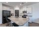 Modern kitchen featuring white cabinetry, granite countertops, and stainless steel appliances at 1255 N Arizona Ave # 1246, Chandler, AZ 85225