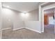 Loft space with neutral colored walls and a hallway view into another room at 1255 N Arizona Ave # 1246, Chandler, AZ 85225