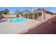 Inviting backyard pool with patio, privacy wall, and mountain view from the house at 13014 N 23Rd Pl, Phoenix, AZ 85022