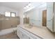 Bathroom featuring a large mirror, vanity with storage, and a shower-tub combination at 13014 N 23Rd Pl, Phoenix, AZ 85022