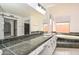 The bathroom boasts dual sinks, tub, and a sliding barn door at 13014 N 23Rd Pl, Phoenix, AZ 85022