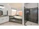 Bright bathroom with walk-in shower, soaking tub and granite countertops at 13014 N 23Rd Pl, Phoenix, AZ 85022