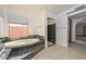 This bathroom features a tub with a large window view and walk-in shower at 13014 N 23Rd Pl, Phoenix, AZ 85022