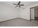 Neutral bedroom with standard ceiling fan, window, and wood trim throughout at 13014 N 23Rd Pl, Phoenix, AZ 85022