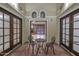 Enclosed courtyard with brick flooring, seating, and view into the living room at 13014 N 23Rd Pl, Phoenix, AZ 85022
