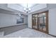 A dining room area with elegant lighting and doors leading to the patio area at 13014 N 23Rd Pl, Phoenix, AZ 85022