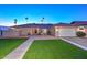 Home exterior with desert landscaping and attached garage at 13014 N 23Rd Pl, Phoenix, AZ 85022