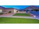 Well-maintained front yard with lush lawn, mature landscaping, and charming curb appeal at 13014 N 23Rd Pl, Phoenix, AZ 85022
