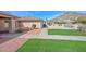 Charming home featuring a well-manicured lawn and desert landscaping at 13014 N 23Rd Pl, Phoenix, AZ 85022