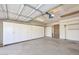 Spacious garage with ample storage cabinets and overhead lighting at 13014 N 23Rd Pl, Phoenix, AZ 85022