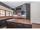 Traditional kitchen features tile flooring, dark wood cabinets, marble countertops, and stainless appliances at 13014 N 23Rd Pl, Phoenix, AZ 85022