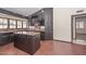 Traditional kitchen features tile flooring, dark wood cabinets, marble countertops, and a center island at 13014 N 23Rd Pl, Phoenix, AZ 85022