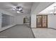 Spacious living area featuring tile and carpet flooring and french doors at 13014 N 23Rd Pl, Phoenix, AZ 85022
