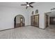 Elegant open layout featuring arched doorways and decorative doorway to the patio at 13014 N 23Rd Pl, Phoenix, AZ 85022