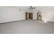 Spacious living room with new carpet and entry ways to other rooms in the house at 13014 N 23Rd Pl, Phoenix, AZ 85022