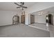 Spacious living area with carpet, tile flooring, and french doors at 13014 N 23Rd Pl, Phoenix, AZ 85022