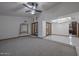 Open-concept living space with tile flooring and arched doorways, offering a flexible layout for entertaining at 13014 N 23Rd Pl, Phoenix, AZ 85022