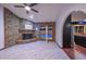 Bright and airy living room with a brick fireplace and access to the pool at 13014 N 23Rd Pl, Phoenix, AZ 85022